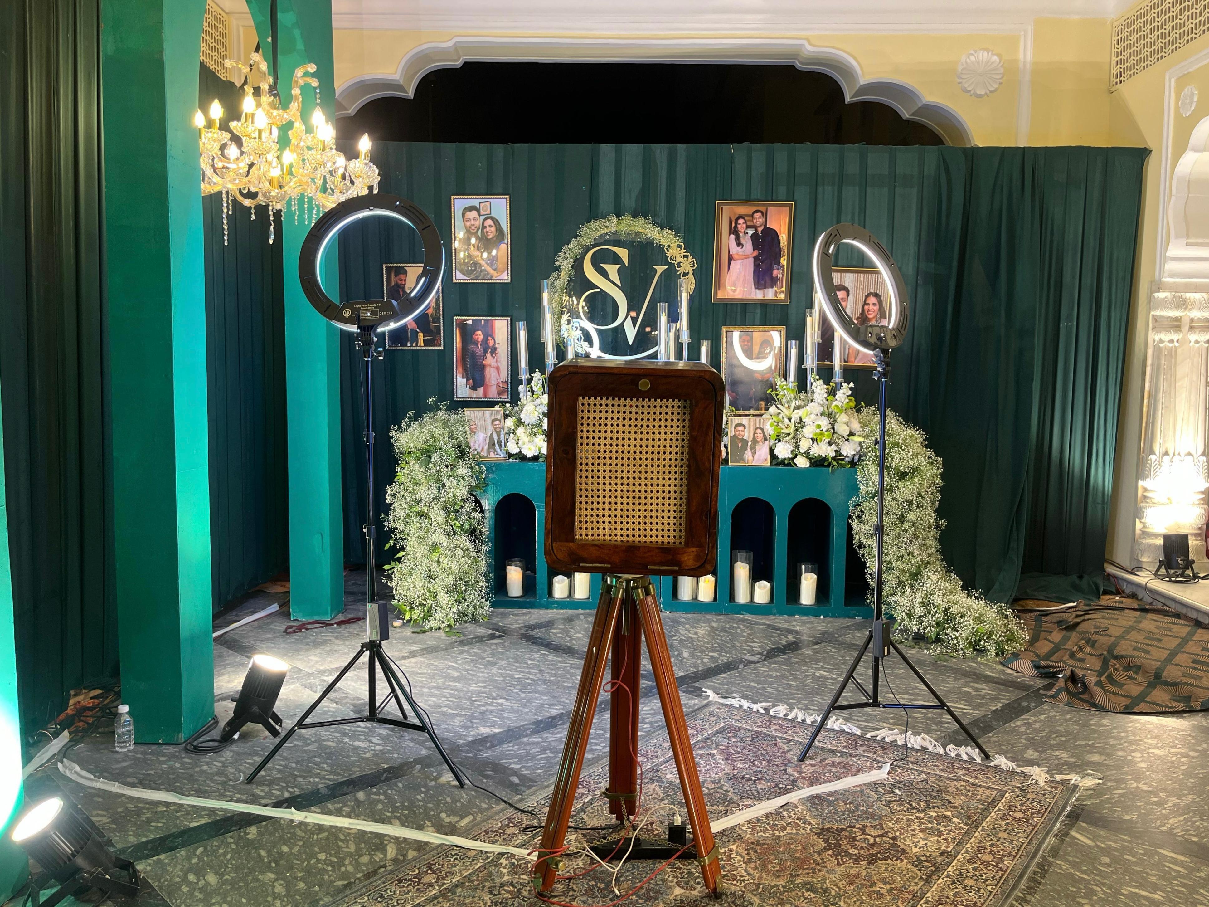 Classic wooden vintage photo booth rental with professional lighting and custom event backdrop for weddings, engagements, corporate events, gala dinners, and private celebrations by Fabx Events.